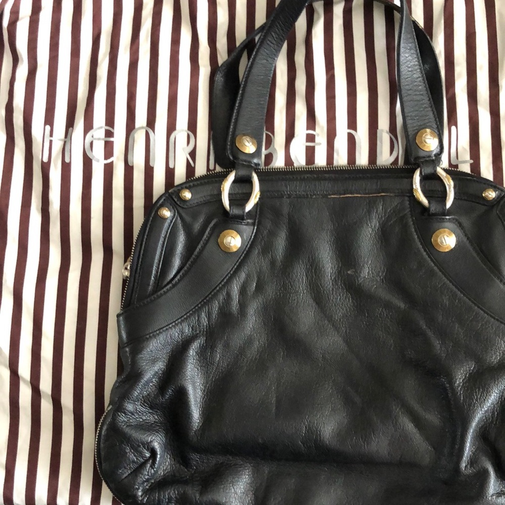 Henri Bendel purse. Own a piece of history with this decadent leather bag.